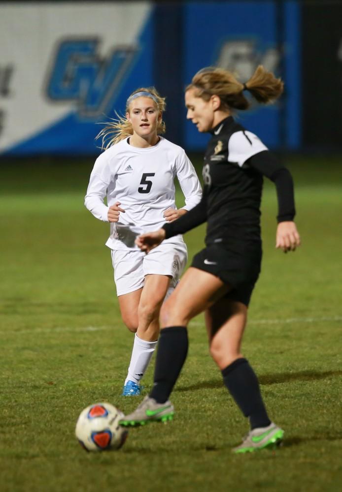 GVL / Kevin Sielaff - Kendra Stauffer (5) pressures the Dominican offense.  Grand Valley defeats Ohio Dominican 3-0 in the semi-finals of the GLIAC tournament Nov. 6 in Allendale.