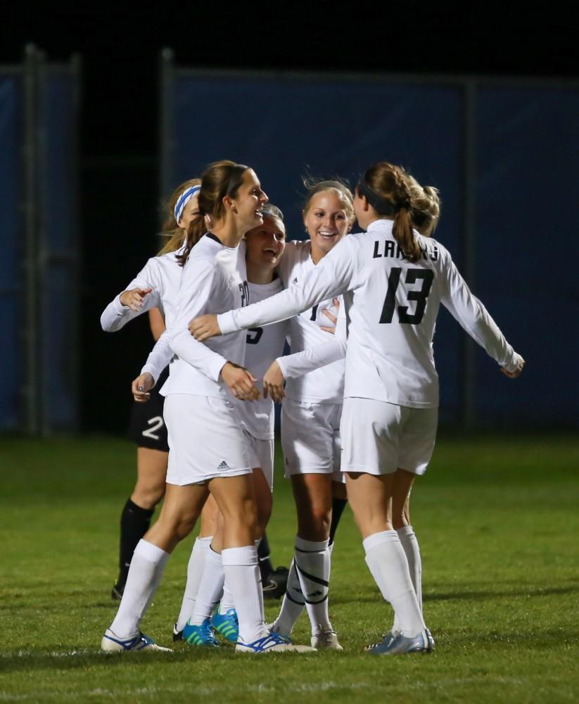 GVL / Kevin Sielaff - The Lakers celebrate a goal by Kendra Stauffer (5).  Grand Valley defeats Ohio Dominican 3-0 in the semi-finals of the GLIAC tournament Nov. 6 in Allendale.