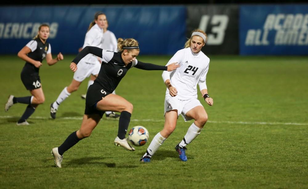 GVL / Kevin Sielaff - Tracey McCoy (24) looks to regain posession.  Grand Valley defeats Ohio Dominican 3-0 in the semi-finals of the GLIAC tournament Nov. 6 in Allendale.