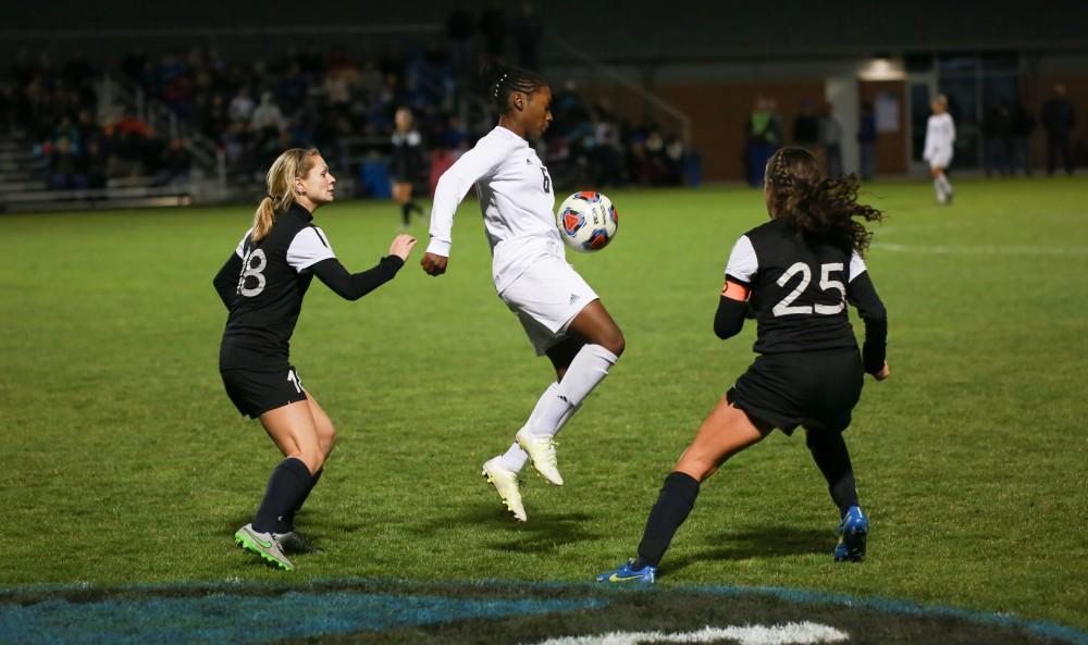 GVL / Kevin Sielaff - Katie Bounds (6) juggles with the ball before playing it toward the opposing net.  Grand Valley defeats Ohio Dominican 3-0 in the semi-finals of the GLIAC tournament Nov. 6 in Allendale.