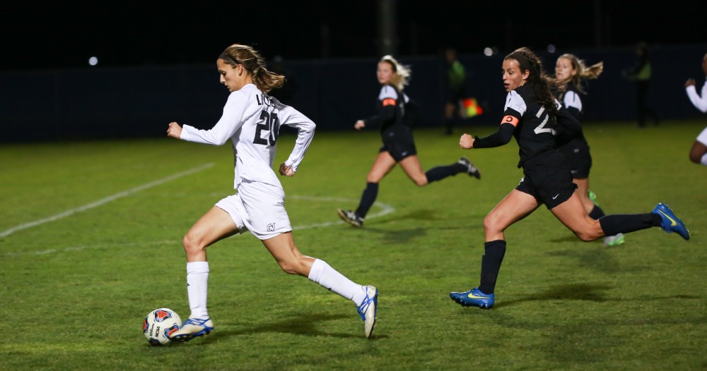 GVL / Kevin Sielaff - Gabriella Mencotti (20) dribbles the ball up field.  Grand Valley defeats Ohio Dominican 3-0 in the semi-finals of the GLIAC tournament Nov. 6 in Allendale.