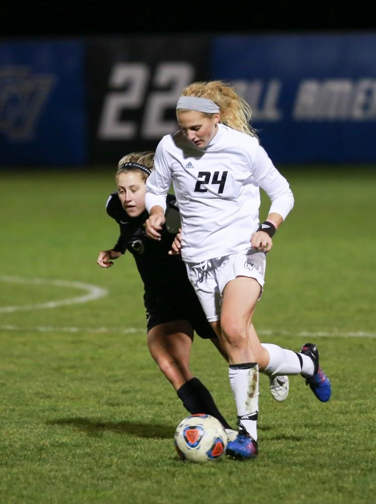 GVL / Kevin Sielaff - Tracey McCoy (24) dribbles the ball up field.  Grand Valley defeats Ohio Dominican 3-0 in the semi-finals of the GLIAC tournament Nov. 6 in Allendale.