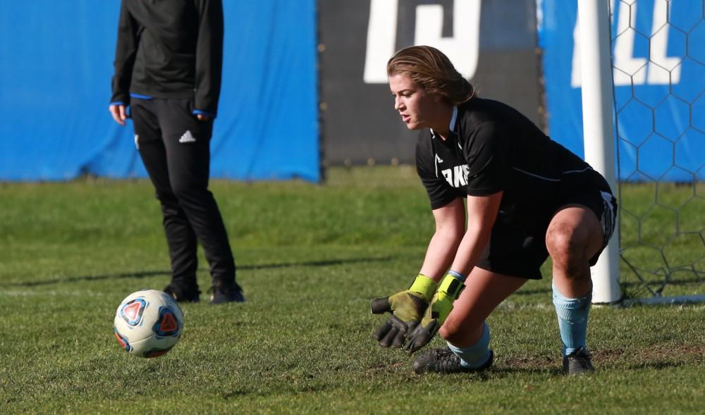 GVL / Kevin Sielaff - Goaltender Emily Maresh (0) warms up before the match.  Grand Valley squares off against Quincy in the second round of the women's soccer NCAA tournament Nov. 15 in Allendale. The Lakers take the victory with a final score of 6-0.