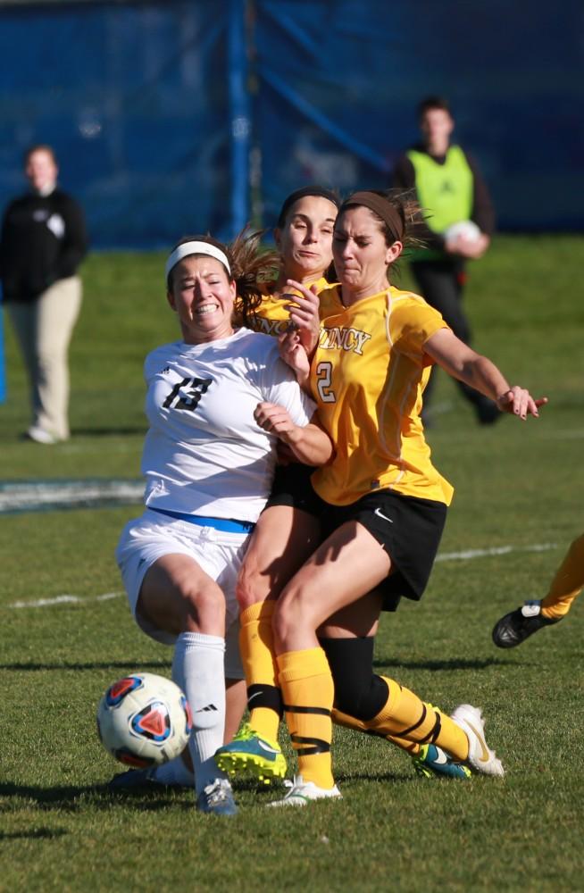 GVL / Kevin Sielaff - Marti Corby (13) powers through the Quincy defensive line.  Grand Valley squares off against Quincy in the second round of the women's soccer NCAA tournament Nov. 15 in Allendale. The Lakers take the victory with a final score of 6-0.