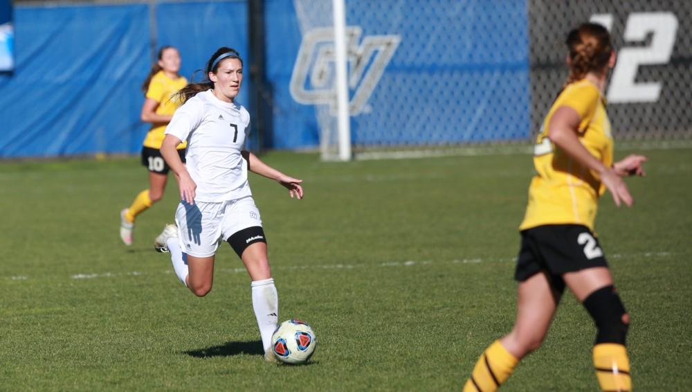 GVL / Kevin Sielaff - Clare Carlson (7) moves the ball up field.  Grand Valley squares off against Quincy in the second round of the women's soccer NCAA tournament Nov. 15 in Allendale. The Lakers take the victory with a final score of 6-0.