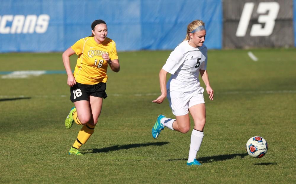 GVL / Kevin Sielaff - Kendra Stauffer (5) pushes the ball up field.  Grand Valley squares off against Quincy in the second round of the women's soccer NCAA tournament Nov. 15 in Allendale. The Lakers take the victory with a final score of 6-0.