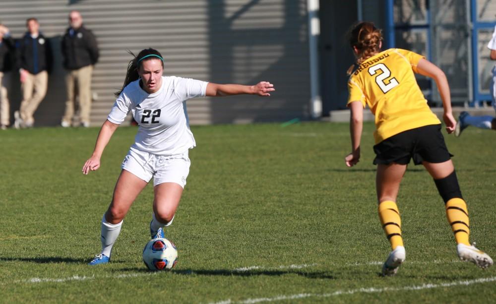 GVL / Kevin Sielaff - Samantha Riga (22) tries a shot and scores.  Grand Valley squares off against Quincy in the second round of the women's soccer NCAA tournament Nov. 15 in Allendale. The Lakers take the victory with a final score of 6-0.