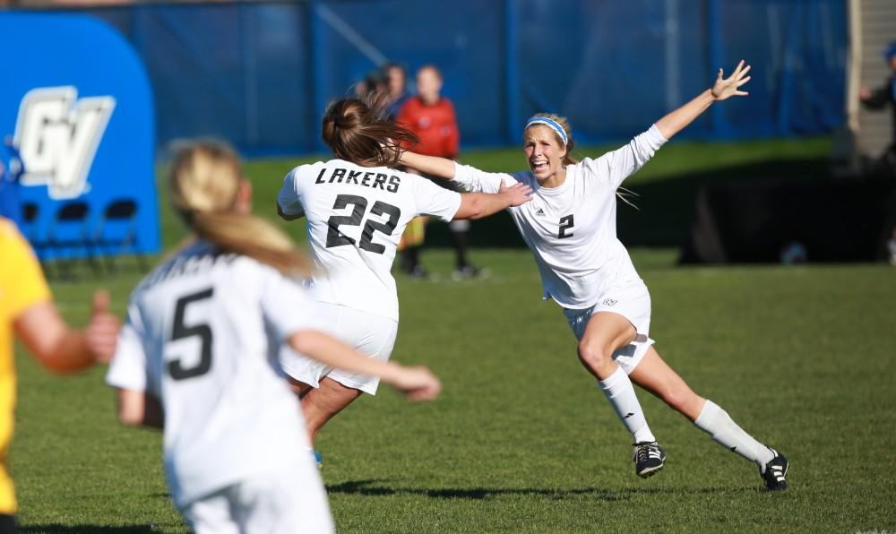 GVL / Kevin Sielaff - Katie Klunder (2) celebrates after a goal by Samantha Riga (22).  Grand Valley squares off against Quincy in the second round of the women's soccer NCAA tournament Nov. 15 in Allendale. The Lakers take the victory with a final score of 6-0.