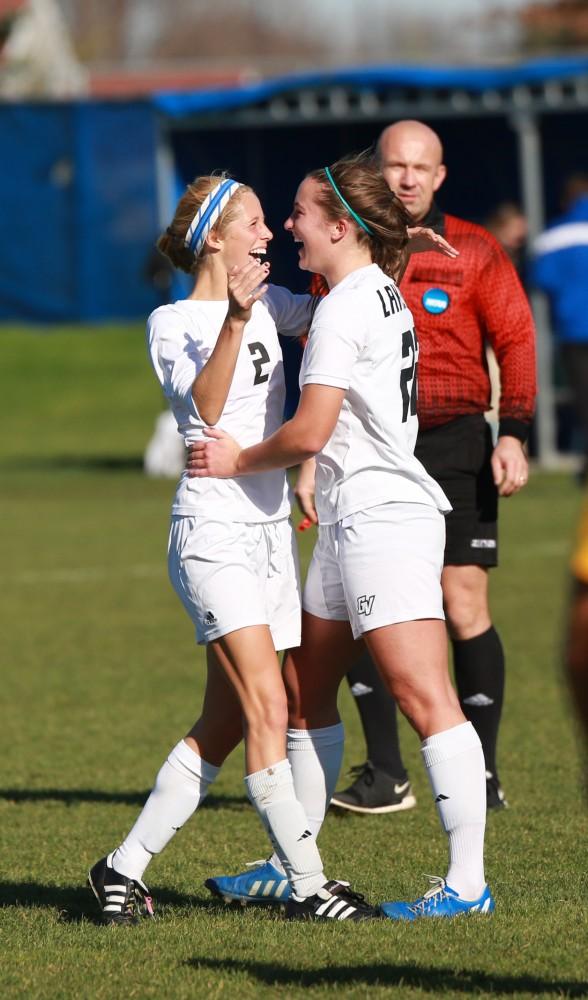 GVL / Kevin Sielaff - Katie Klunder (2) and Samantha Riga (22) celebrate a goal.  Grand Valley squares off against Quincy in the second round of the women's soccer NCAA tournament Nov. 15 in Allendale. The Lakers take the victory with a final score of 6-0.