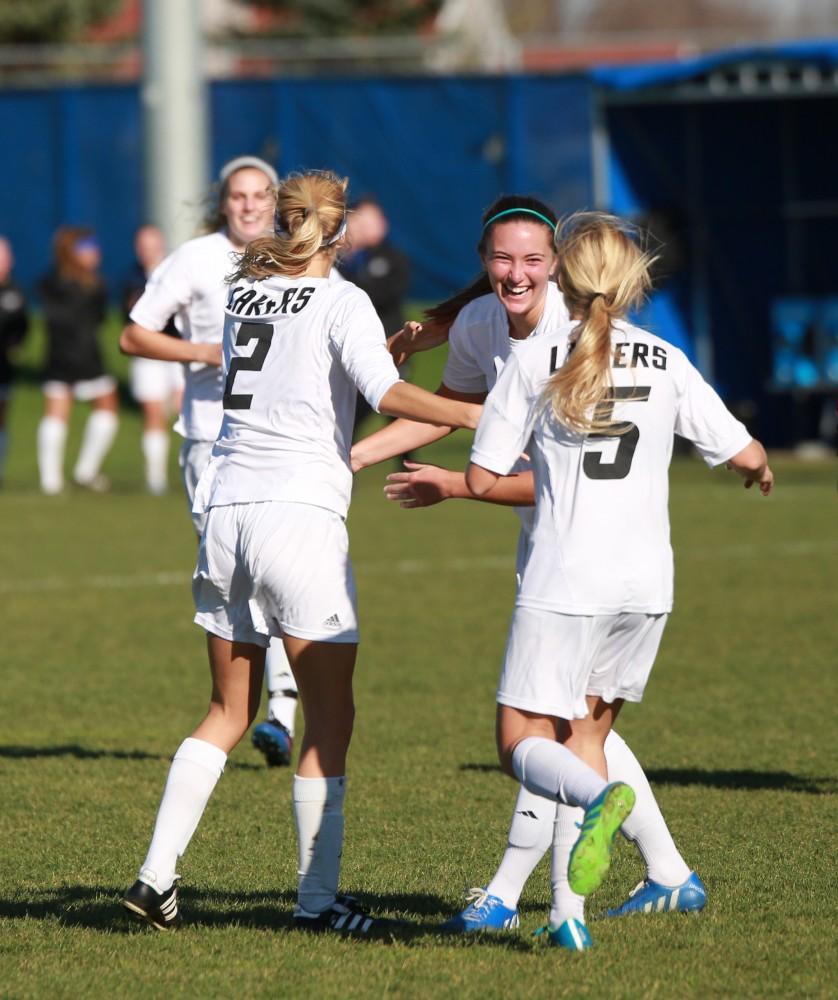 GVL / Kevin Sielaff - Samantha Riga (22) celebrates her goal.  Grand Valley squares off against Quincy in the second round of the women's soccer NCAA tournament Nov. 15 in Allendale. The Lakers take the victory with a final score of 6-0.