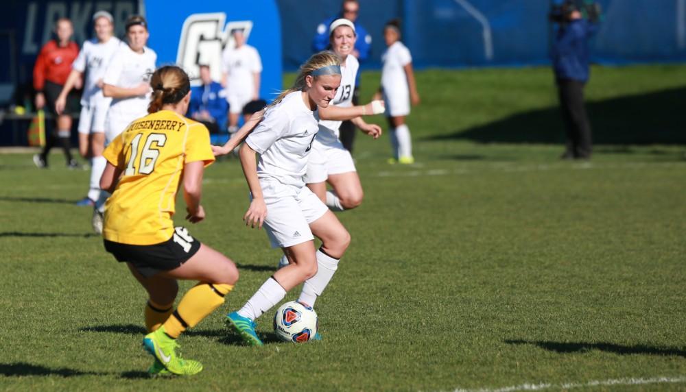 GVL / Kevin Sielaff - Kendra Stauffer (5) moves the ball up field.  Grand Valley squares off against Quincy in the second round of the women's soccer NCAA tournament Nov. 15 in Allendale. The Lakers take the victory with a final score of 6-0.