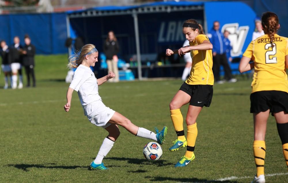 GVL / Kevin Sielaff - Kendra Stauffer (5) tries a shot, but is blocked.  Grand Valley squares off against Quincy in the second round of the women's soccer NCAA tournament Nov. 15 in Allendale. The Lakers take the victory with a final score of 6-0.