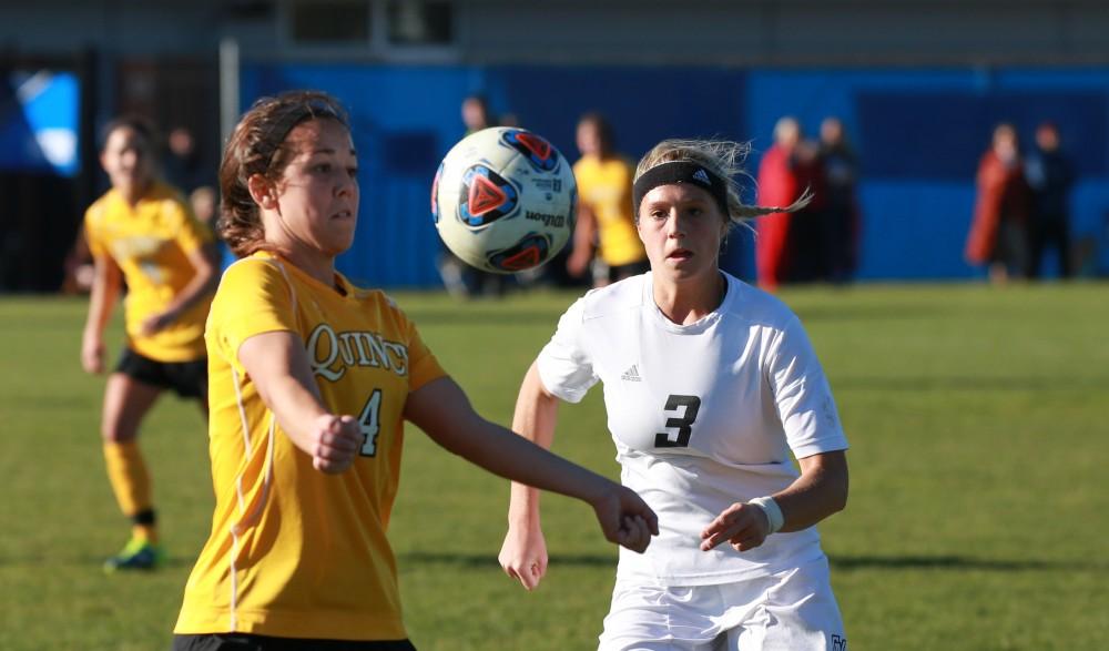 GVL / Kevin Sielaff - Gabbie Guibord (3) moves in on Quincy's Taylor Lindwedel (4).  Grand Valley squares off against Quincy in the second round of the women's soccer NCAA tournament Nov. 15 in Allendale. The Lakers take the victory with a final score of 6-0.