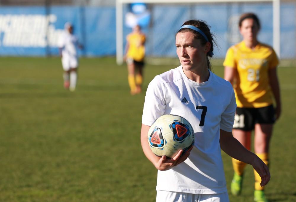 GVL / Kevin Sielaff - Clare Carlson (7) prepares to throw the ball in bounds.  Grand Valley squares off against Quincy in the second round of the women's soccer NCAA tournament Nov. 15 in Allendale. The Lakers take the victory with a final score of 6-0.