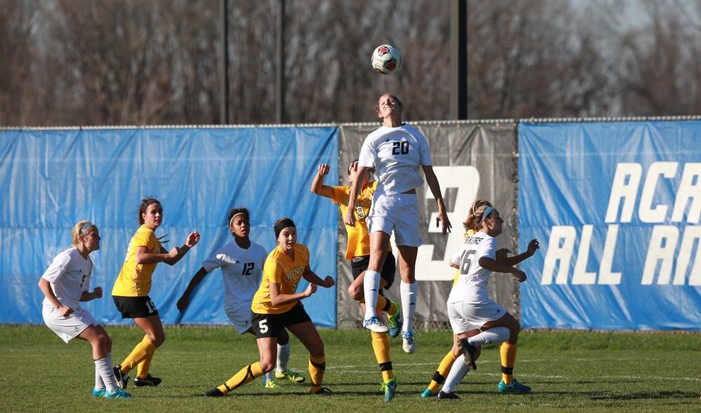 GVL / Kevin Sielaff - Gabriella Mencotti (20) heads the ball on net.  Grand Valley squares off against Quincy in the second round of the women's soccer NCAA tournament Nov. 15 in Allendale. The Lakers take the victory with a final score of 6-0.