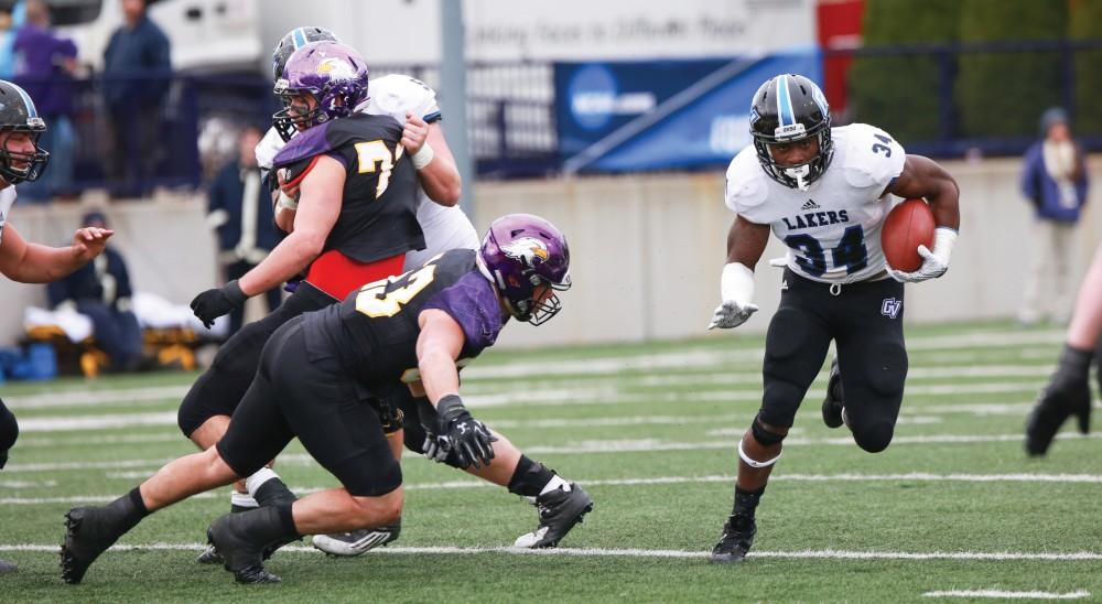 GVL / Kevin Sielaff -  Marty Carter (34) rushes the ball to the 35 yard line.  Grand Valley defeats Ashland with a final score of 45-28 Nov. 22 at Ashland University.