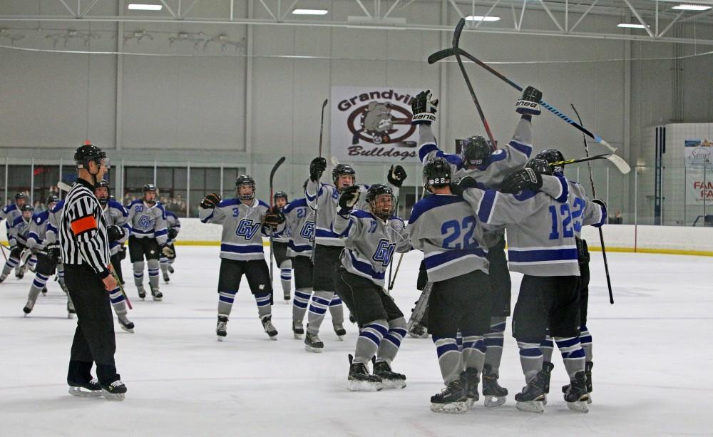 GVL / Emily Frye       
The Grand Valley State University D3 Hockey team celebrates the game winning goal in overtime against Saginaw Valley State University on Nov. 7th.