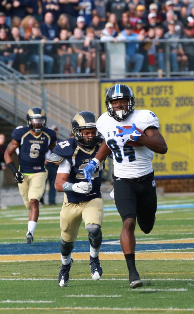 GVL / Kevin Sielaff - Urston Smith (84) receives a catch and looks to gain yardage.  The Lakers fall to the Rams of Shepard University with a final score of 34-32 Dec. 12 in Shepardstown, West Virginia.