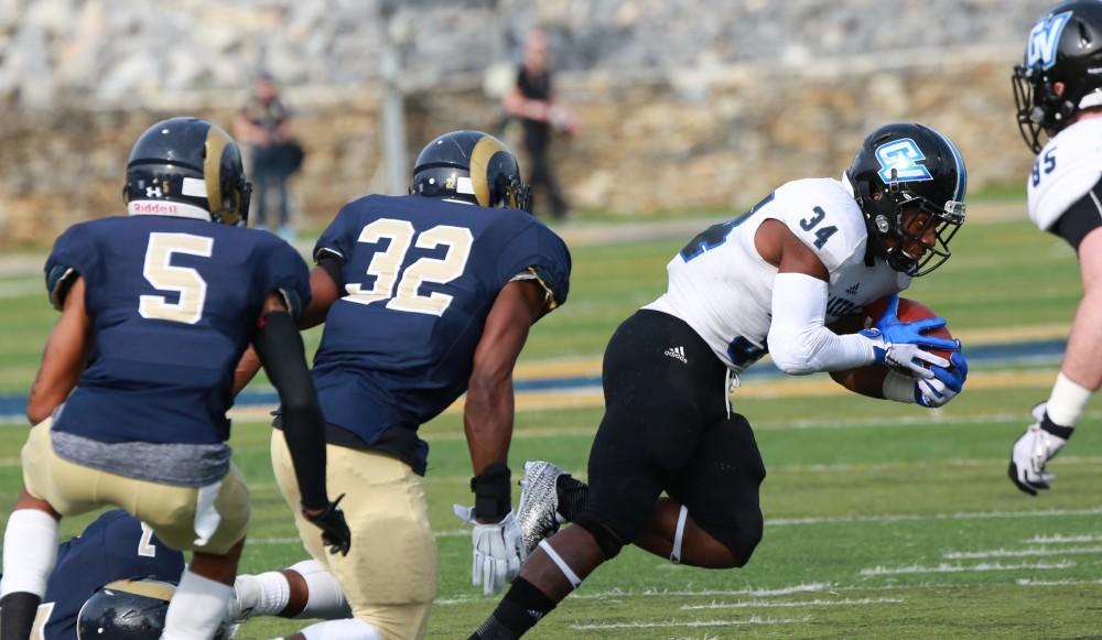 GVL / Kevin Sielaff - Marty Carter (34) pivots around the Shepard defensive line.  The Lakers fall to the Rams of Shepard University with a final score of 34-32 Dec. 12 in Shepardstown, West Virginia.