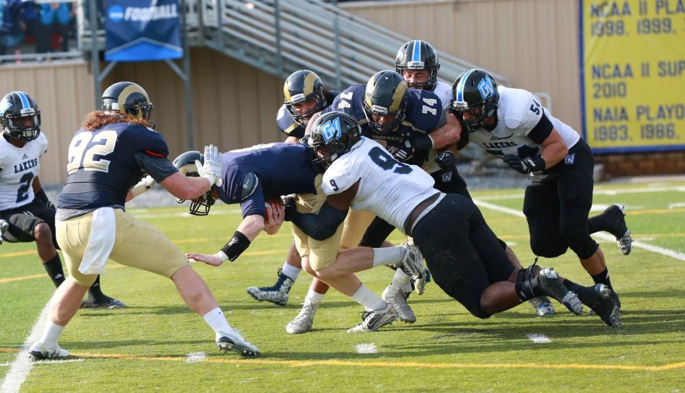 GVL / Kevin Sielaff - Matt Judon (9) gets in on the Shepard defense and makes a tackle.  The Lakers fall to the Rams of Shepard University with a final score of 34-32 Dec. 12 in Shepardstown, West Virginia.