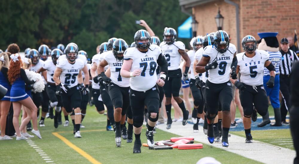 GVL / Kevin Sielaff - Jim Walsh (78) and company sprint onto the field at the start of the match.  The Lakers fall to the Rams of Shepard University with a final score of 34-32 Dec. 12 in Shepardstown, West Virginia.