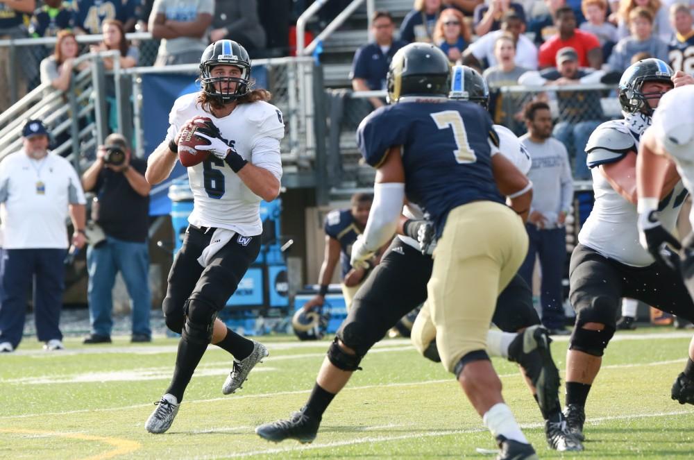 GVL / Kevin Sielaff - Bart Williams (6) scans the end zone while he looks for a receiver.  The Lakers fall to the Rams of Shepard University with a final score of 34-32 Dec. 12 in Shepardstown, West Virginia.