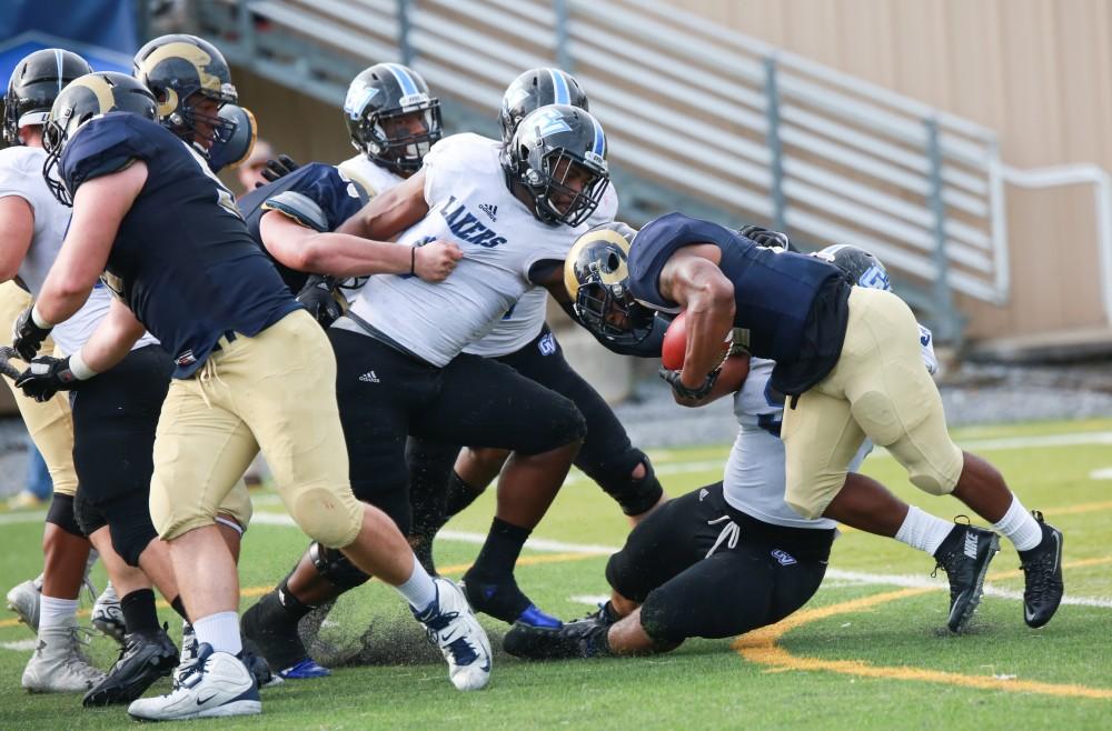 GVL / Kevin Sielaff - Matt Judon (9) gets in on the Shepard defense to stop a run.  The Lakers fall to the Rams of Shepard University with a final score of 34-32 Dec. 12 in Shepardstown, West Virginia.