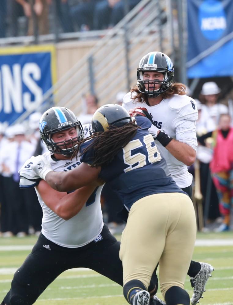 GVL / Kevin Sielaff - Bart Williams (6) scans down field as he looks for a receiver.  The Lakers fall to the Rams of Shepard University with a final score of 34-32 Dec. 12 in Shepardstown, West Virginia.