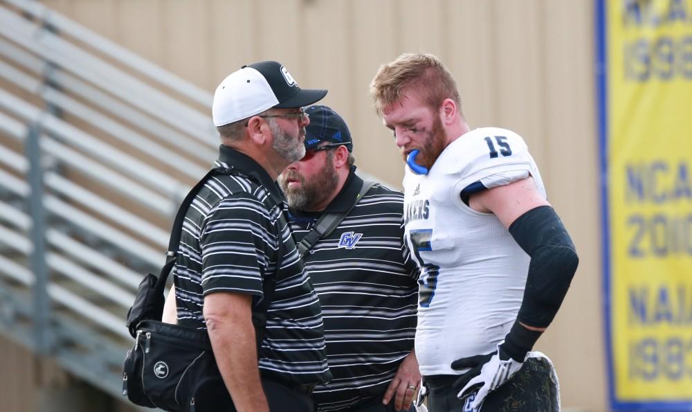 GVL / Kevin Sielaff - Jamie Potts (15), injured in the end zone, is tended to by medial personnel.  The Lakers fall to the Rams of Shepard University with a final score of 34-32 Dec. 12 in Shepardstown, West Virginia.