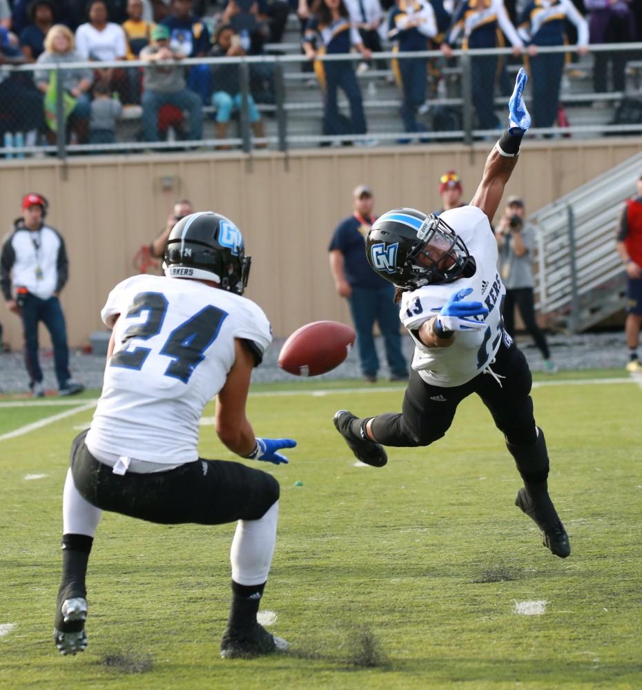 GVL / Kevin Sielaff - Justice Wright (13), the intended receiver, misses the catch but Matt Williams (24) comes in to pick it up.  The Lakers fall to the Rams of Shepard University with a final score of 34-32 Dec. 12 in Shepardstown, West Virginia.