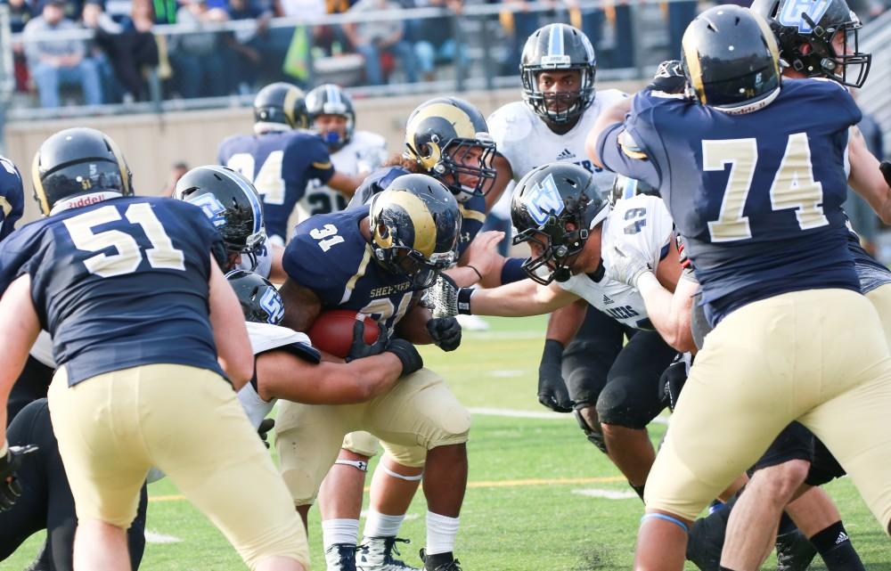 GVL / Kevin Sielaff - Collin Schlosser (49) moves in to make a tackle.  The Lakers fall to the Rams of Shepard University with a final score of 34-32 Dec. 12 in Shepardstown, West Virginia.