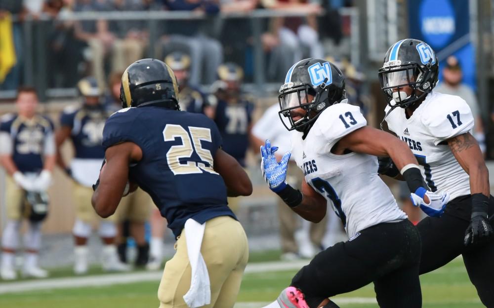 GVL / Kevin Sielaff - Justice Wright (13) moves in for the tackle against Keon Robinson (25) of Shepard.  The Lakers fall to the Rams of Shepard University with a final score of 34-32 Dec. 12 in Shepardstown, West Virginia.