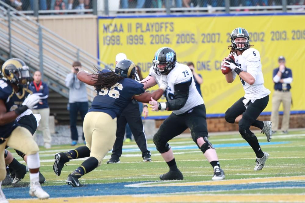 GVL / Kevin Sielaff - Bart Williams (6) looks to make a pass down field.  The Lakers fall to the Rams of Shepard University with a final score of 34-32 Dec. 12 in Shepardstown, West Virginia.