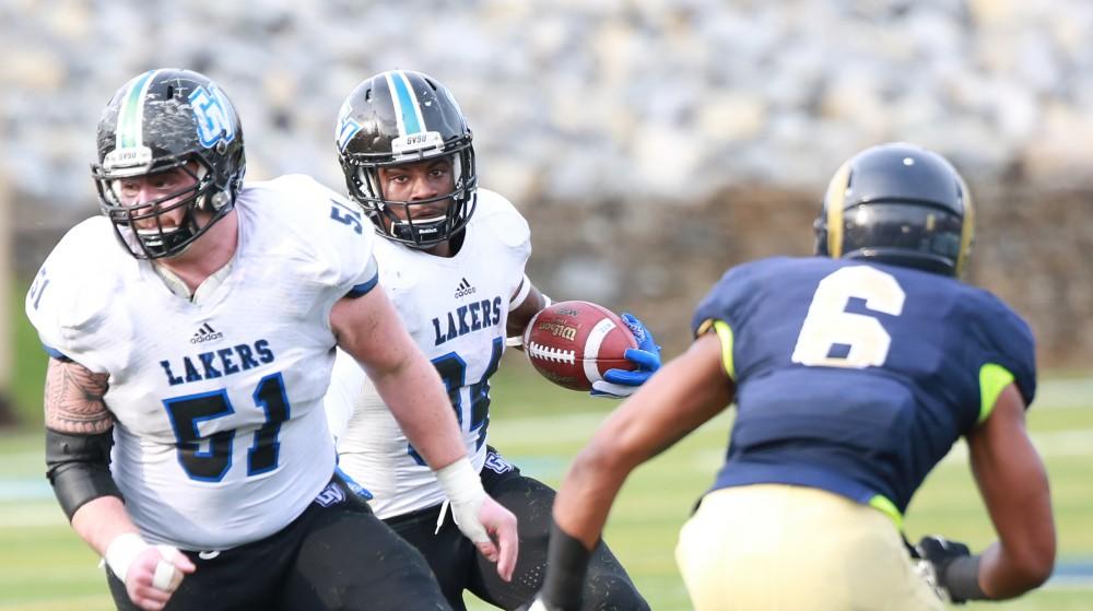 GVL / Kevin Sielaff - Marty Carter (34) turns a corner and must evade several defense men.  The Lakers fall to the Rams of Shepard University with a final score of 34-32 Dec. 12 in Shepardstown, West Virginia.