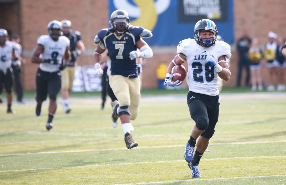 GVL / Kevin Sielaff - Tre Walton (28) returns a blocked kick to the end zone.  The Lakers fall to the Rams of Shepard University with a final score of 34-32 Dec. 12 in Shepardstown, West Virginia.