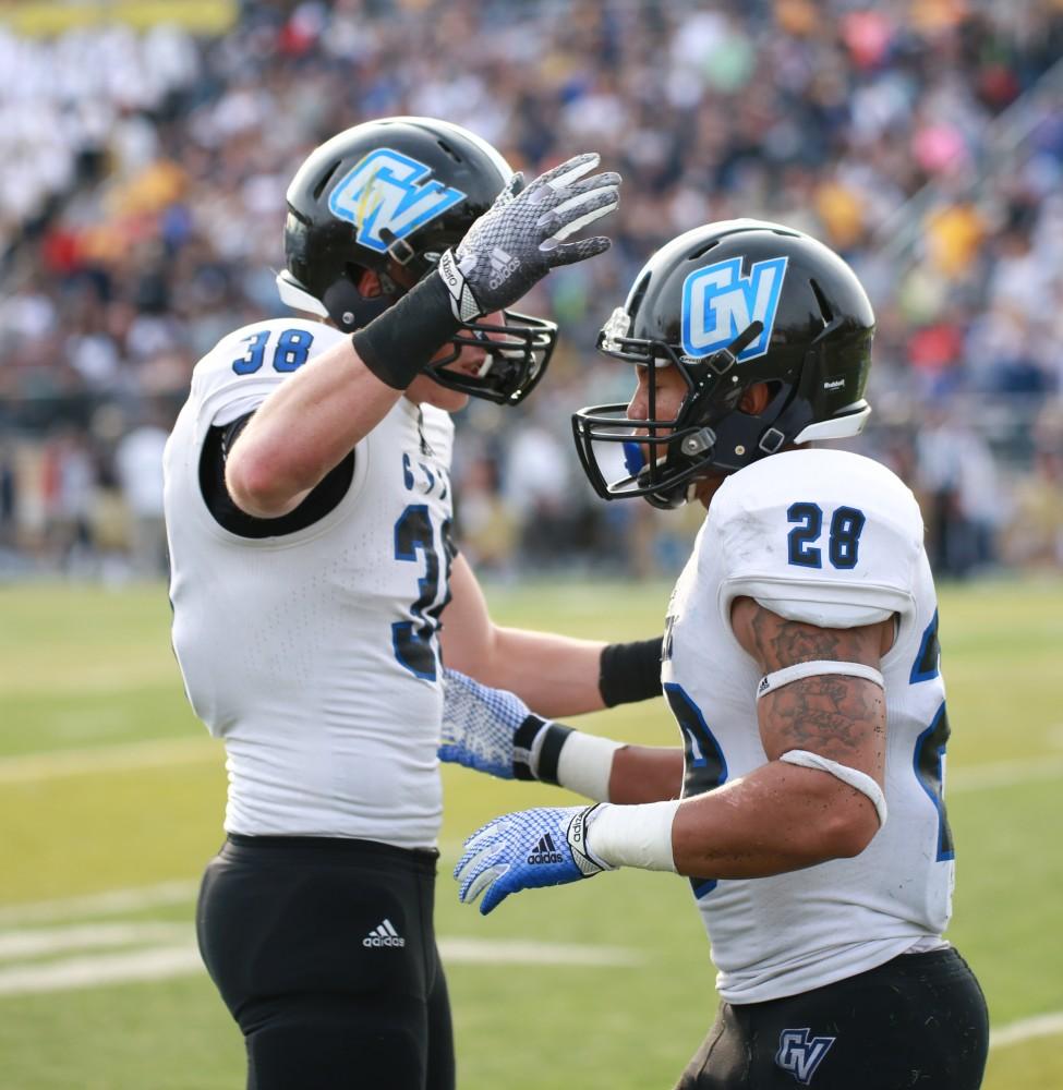 GVL / Kevin Sielaff - Tre Walton (28) celebrates with his teammates after returning a blocked kick to the end zone.  The Lakers fall to the Rams of Shepard University with a final score of 34-32 Dec. 12 in Shepardstown, West Virginia.