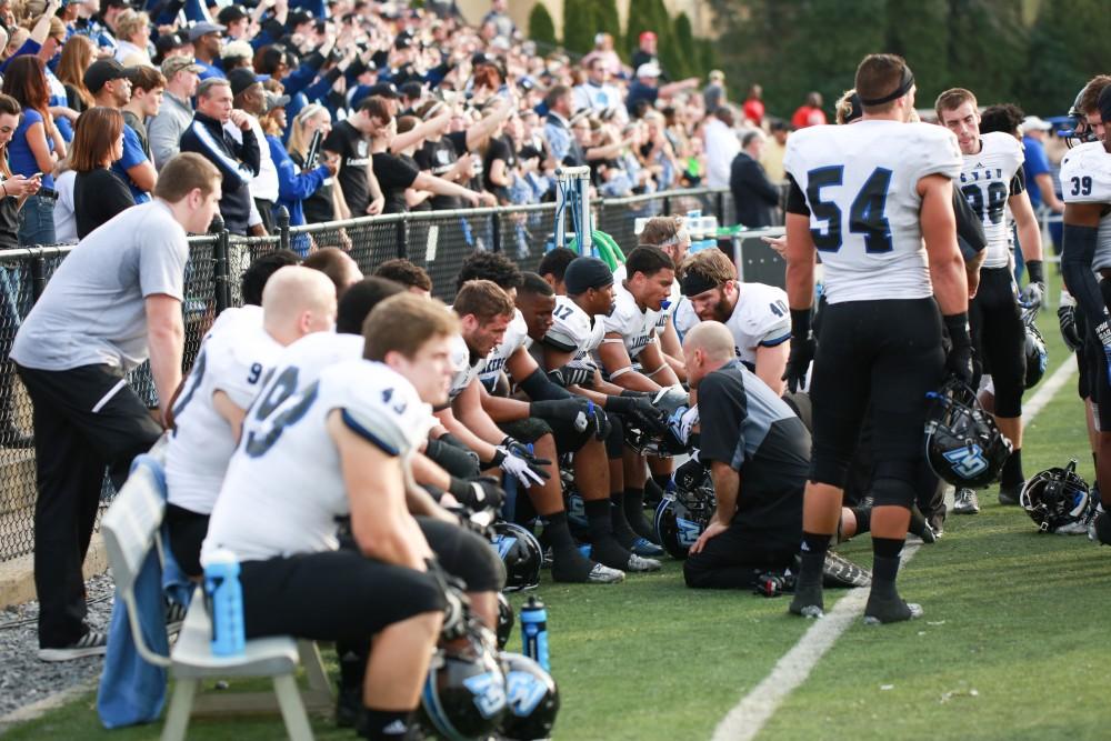 GVL / Kevin Sielaff - Jim Louis speaks with his line men on the Grand Valley bench.  The Lakers fall to the Rams of Shepard University with a final score of 34-32 Dec. 12 in Shepardstown, West Virginia.