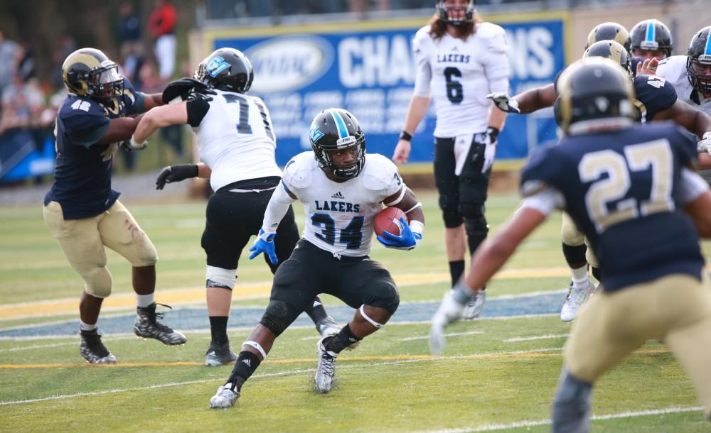 GVL / Kevin Sielaff - Marty Carter (34) runs the ball toward the end zone.  The Lakers fall to the Rams of Shepard University with a final score of 34-32 Dec. 12 in Shepardstown, West Virginia.