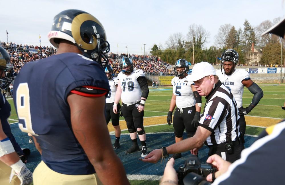 GVL / Kevin Sielaff - Grand Valley and Shepard meet at the center of the field for the coin toss.  The Lakers fall to the Rams of Shepard University with a final score of 34-32 Dec. 12 in Shepardstown, West Virginia.