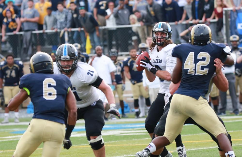 GVL / Kevin Sielaff - Bart Williams (6) looks to throw a deep pass.  The Lakers fall to the Rams of Shepard University with a final score of 34-32 Dec. 12 in Shepardstown, West Virginia.