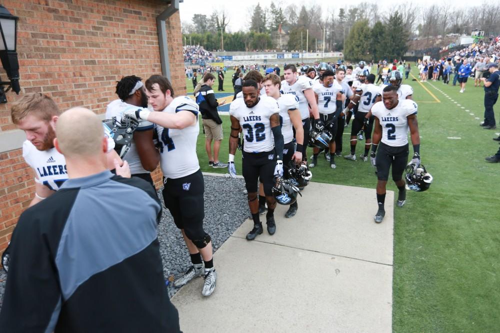 GVL / Kevin Sielaff - Matt Judon congratulates his team as they exit the field.   The Lakers fall to the Rams of Shepard University with a final score of 34-32 Dec. 12 in Shepardstown, West Virginia.