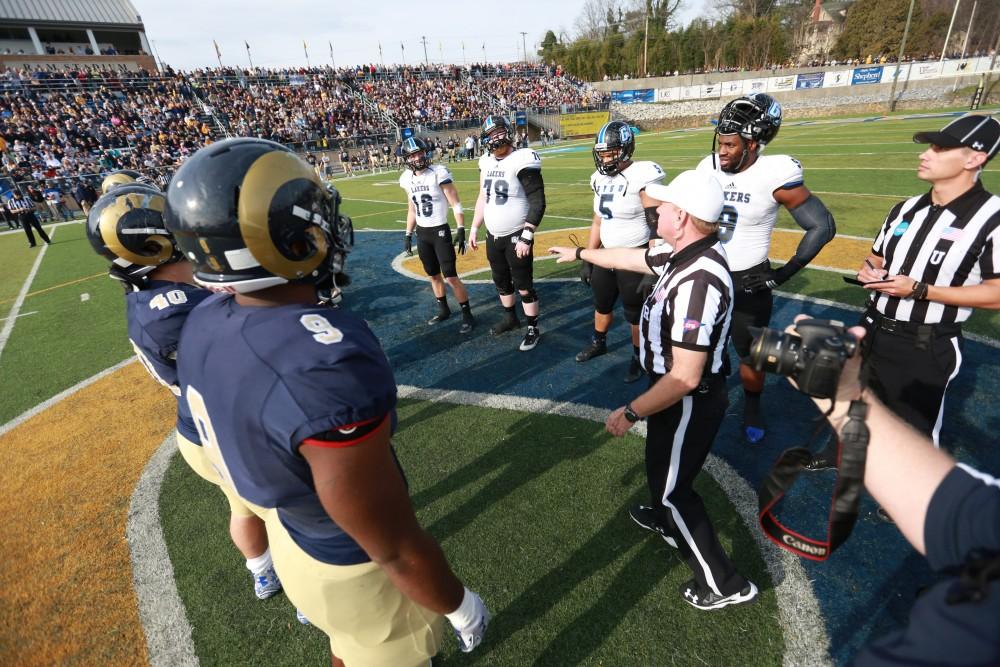 GVL / Kevin Sielaff - Grand Valley and Shepard meet at the center of the field for the coin toss.  The Lakers fall to the Rams of Shepard University with a final score of 34-32 Dec. 12 in Shepardstown, West Virginia.