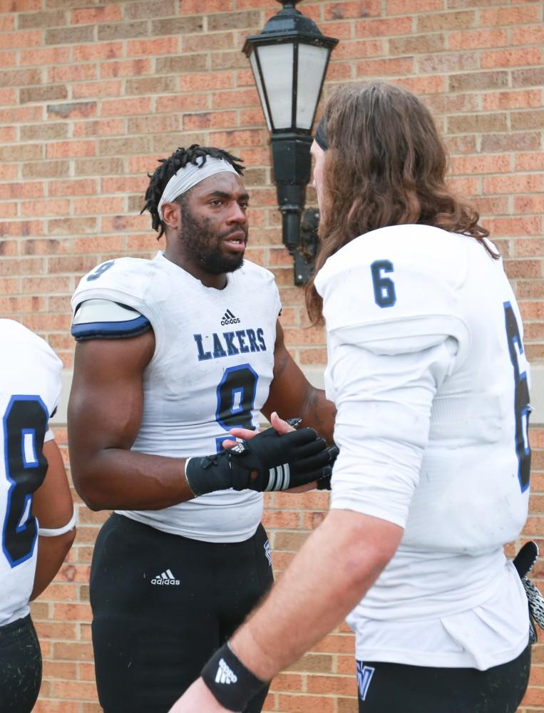 GVL / Kevin Sielaff -  Matt Judon (9) and Bart Williams (6) shake hands after the match comes to a close.  The Lakers fall to the Rams of Shepard University with a final score of 34-32 Dec. 12 in Shepardstown, West Virginia.