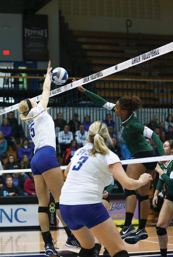 GVL / Kevin Sielaff - Kaleigh Lound (15) blocks a tip. Grand Valley sweeps Tiffin Oct. 3 after three sets inside the Fieldhouse Arena in Allendale.