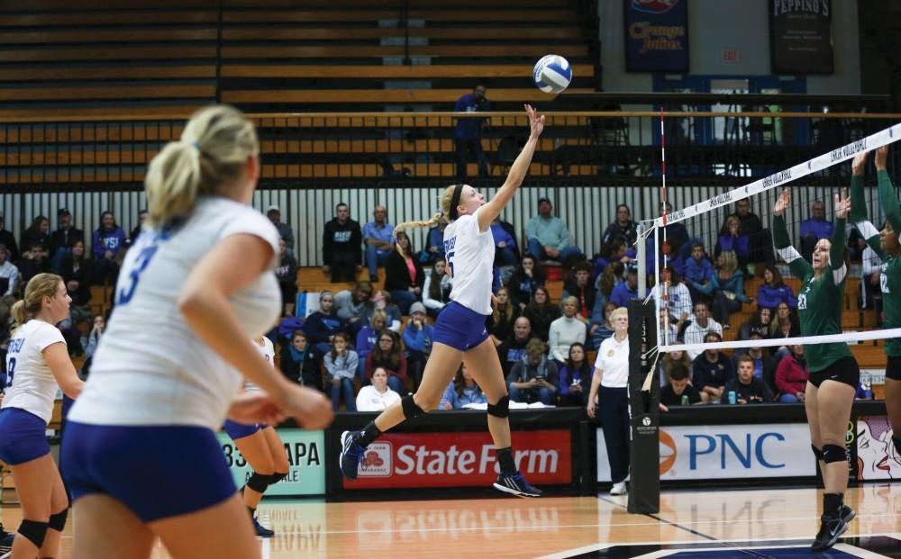 GVL / Kevin Sielaff - Kaleigh Lound (15) tips the ball high over the net. Grand Valley sweeps Tiffin Oct. 3 after three sets inside the Fieldhouse Arena in Allendale.