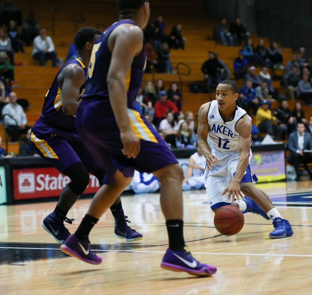 GVL / Kevin Sielaff - Myles Miller (12) powers into the lane.  The Lakers fall to the Eagles of Ashland University in a tough overtime loss Dec. 3 in Allendale. The final score was 76-72.