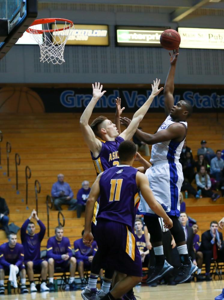 GVL / Kevin Sielaff - Trevin Alexander (5) tries a floater and elevates above the defense.  The Lakers fall to the Eagles of Ashland University in a tough overtime loss Dec. 3 in Allendale. The final score was 76-72.