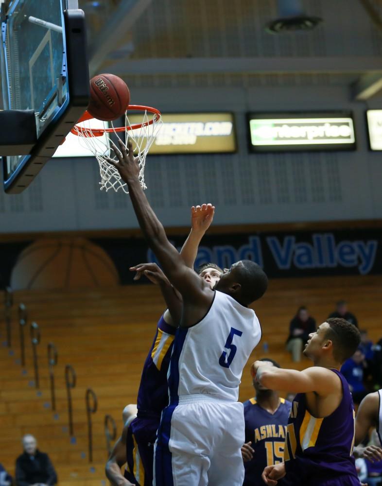 GVL / Kevin Sielaff - Trevin Alexander (5) banks the ball into the net.  The Lakers fall to the Eagles of Ashland University in a tough overtime loss Dec. 3 in Allendale. The final score was 76-72.