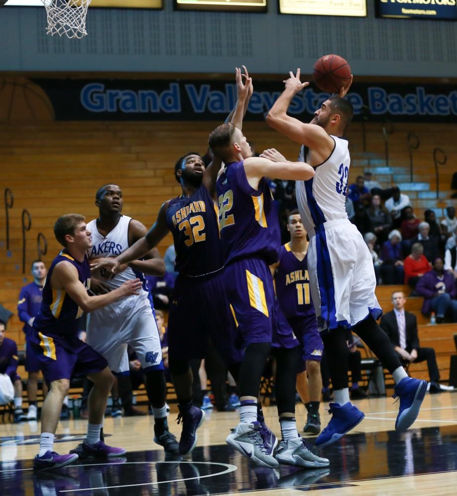 GVL / Kevin Sielaff - Ricardo Carbajal (32) powers down the lane and tries a shot.  The Lakers fall to the Eagles of Ashland University in a tough overtime loss Dec. 3 in Allendale. The final score was 76-72.