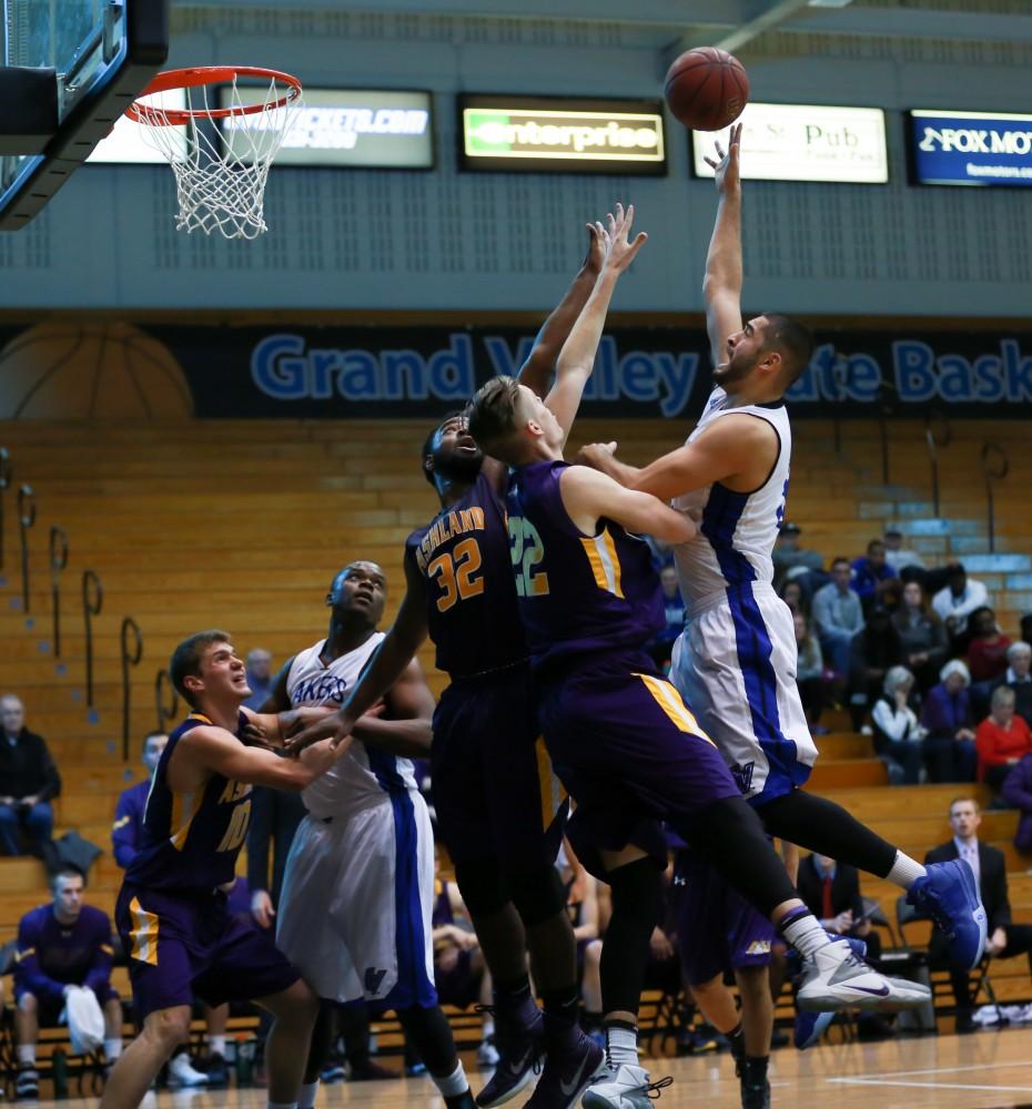 GVL / Kevin Sielaff - Ricardo Carbajal (32) elevates above the defense and tries a shot.  The Lakers fall to the Eagles of Ashland University in a tough overtime loss Dec. 3 in Allendale. The final score was 76-72.